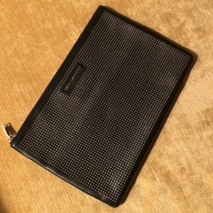 Saint Laurent leather clutch.